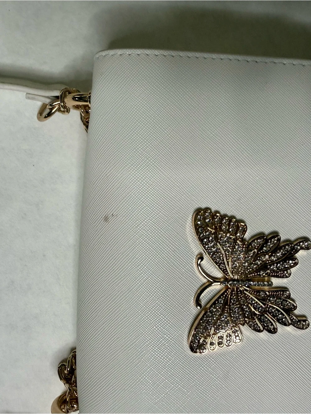 ALDO White Crossbody Bag with Gold Butterfly Accent